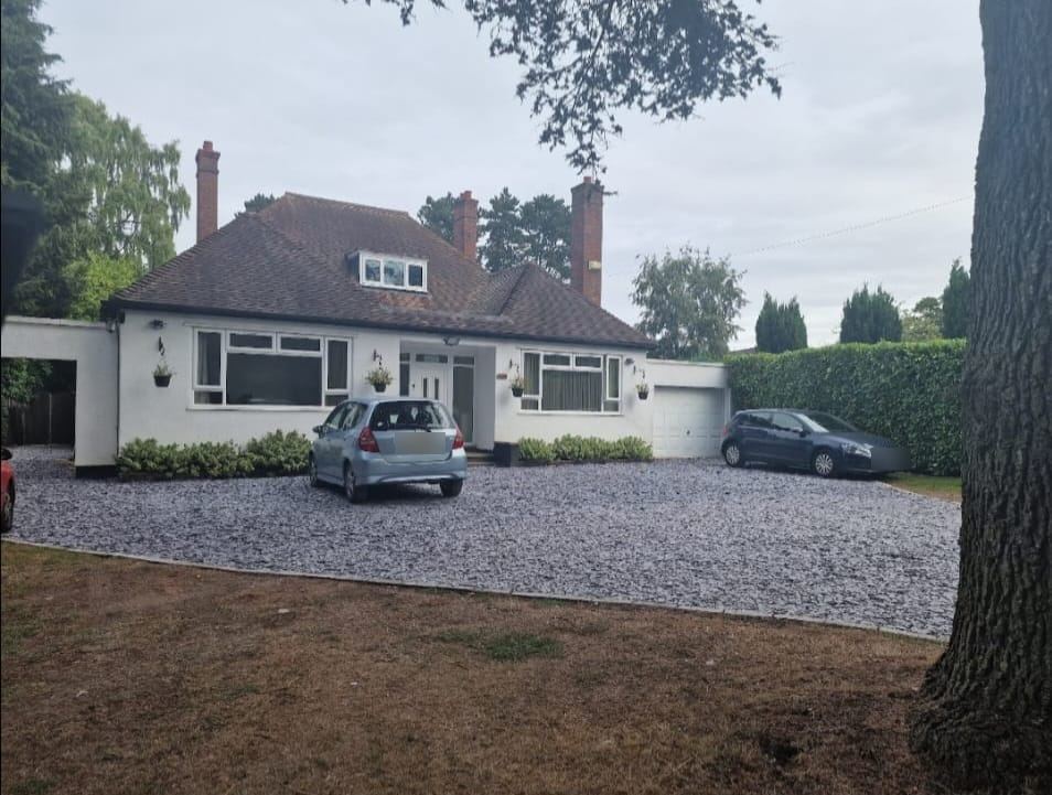 Front of Wrottesley Care home with driveway and garden
