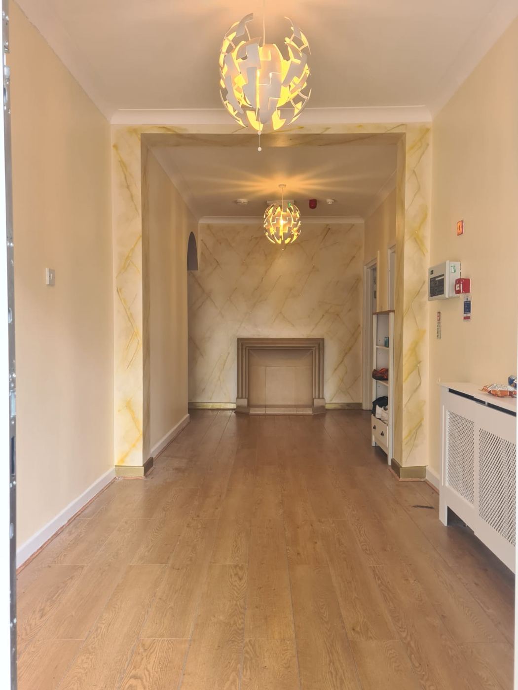 Bright entrance hallway with wooden floor